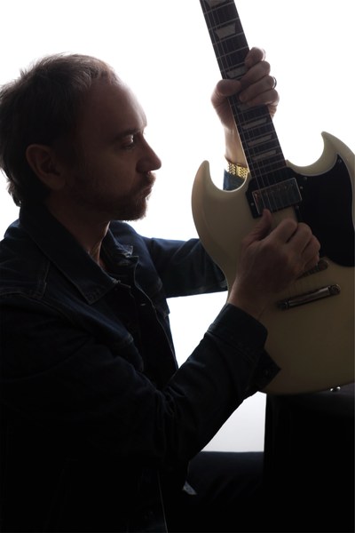Doug Gillard with white SG guitar