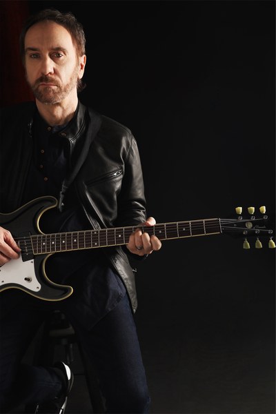 Doug Gillard with black electric guitar